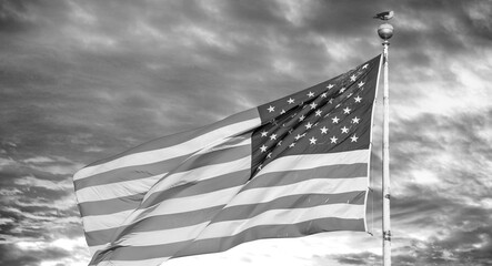 Wall Mural - Sunset colors on the background of a waving beautiful american flag