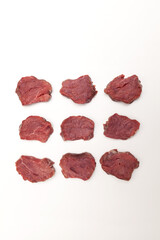 Wall Mural - Juicy pieces of meat, top view. Beef tenderloin steaks lie in rows