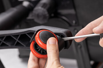 adjusting or repair office armchair. worker fixing arm chair. close up. diy concept