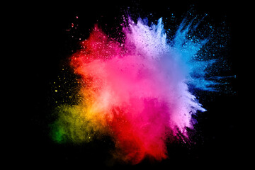 Wall Mural - Abstract multi color powder explosion on black background. Freeze motion of color dust particles splash. Painted Holi.