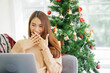 © chinnarach - close up young asian woman feeling surprise during using laptop after get discount promotion on marketplace website (online shopping) in black friday and cyber Monday of christmas festival concept