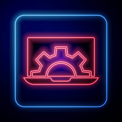 Glowing neon Software, web development, programming concept icon isolated on blue background. Programming language and program code on screen laptop. Vector.