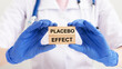 Placebo effect concept inscription. doctor hands close up