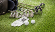 © Rawf8 - Golf equipment on green grass golf course, close up view.