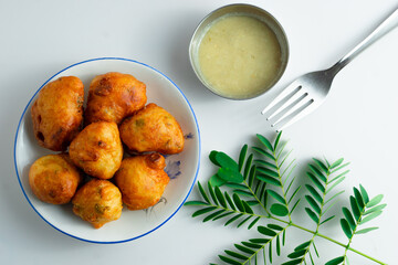 Wall Mural - Fresh mysore bonda in a plate on a white background