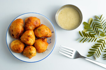 Wall Mural - Fresh mysore bonda in a plate on a white background