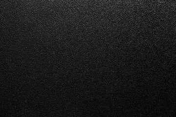 dark background of hammered powder paint coating on flat sheet steel surface