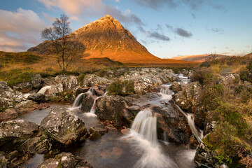  Glen Etive waterfall on a sunny Autumn morning in the Scottish Highlands.