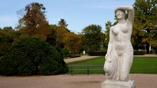 Aurora Also Called Pagan Woman Sculpture In Lazienki Krolweskie, Royal Baths Park In Warsaw City, Poland