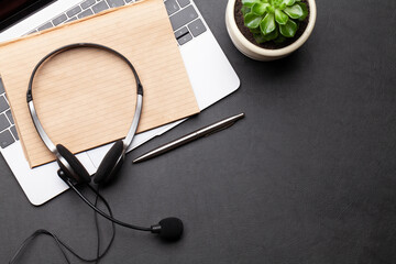 Wall Mural - Office desk with headset and laptop