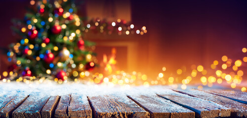 abstract christmas - snowy table with bokeh lights and defocused christmas tree