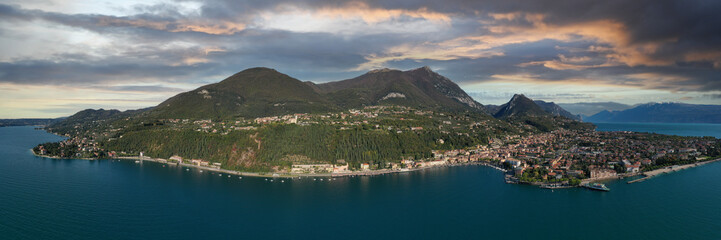 Panoramic view of the historic city of Toscolano Maderno on Lake Garda Italy. Aerial view of the town on Lake Garda. Tourist place on Lake Garda in the background Alps and blue sky.