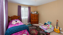 A Little Girls Bedroom Is Also A Playroom