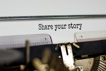 Text 'share your story' typed on retro typewriter. Business concept. Copy space.