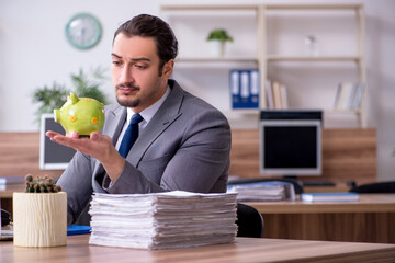 Young male employee working in the office