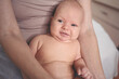 © Алина Троева - Cute emotional funny smiling newborn little baby infant boy sitting on mother hands. Healthy child