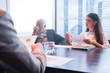 © torsakh - Executive business people wear suit have meeting and talking and discussing in conference room, leader present result and idea to the team by using tablet and document