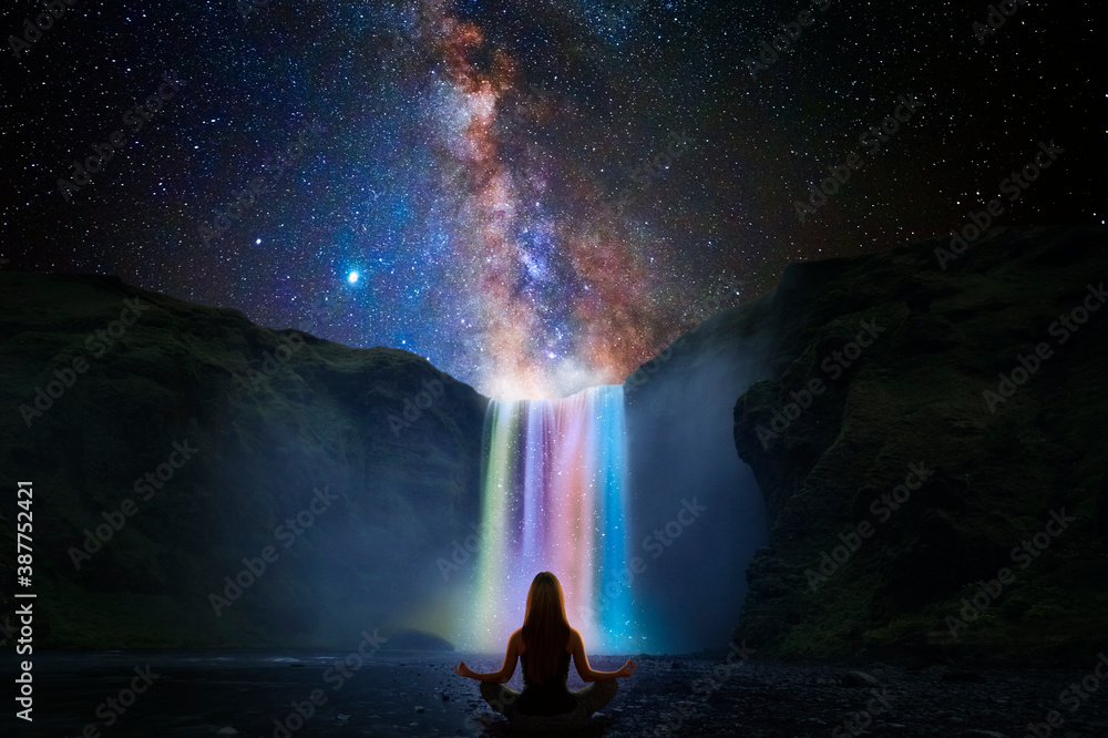 Woman doing yoga in front of a magic waterfall - obrazy, fototapety, plakaty 