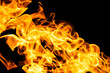 © Yevgeniy - Fire flames on black background isolated. Burning gas or gasoline burns with fire and flames. Flaming burning sparks close-up, fire patterns. Infernal glow of fire in the dark with copy-space