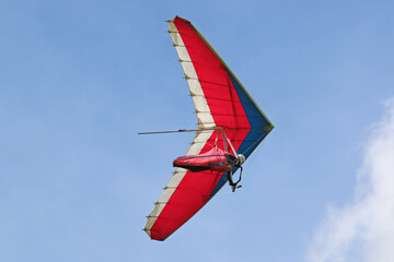 Hang Glider flying in a blue sky