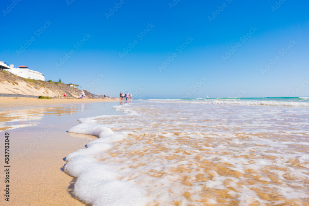 Sandy beach and calm sea in the Canary Islands - obrazy, fototapety, plakaty 