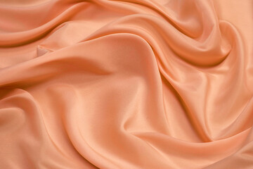 Wall Mural - Close up pink silk fabric. The pink fabric is laid out waves. Pink satin fabric for background or texture.