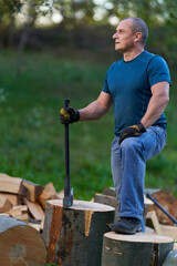 Farmer splitting logs