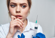© SHOTPRIME STUDIO - Woman syringe anesthesia botox injection doctor blue gloves