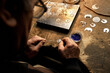 Hand-made silver items with cloisonné enamel in progress. Traditional work in the mountain village of Kubachi, Dagestan.