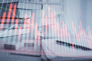 Double exposure of financial chart drawing and desktop with coffee and items on table background. Concept of forex market trading