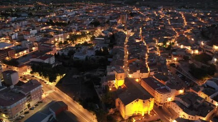 Wall Mural - Aerial view of medieval fortified Castalla Castle on top of stone hill on background with townscape in twilight, province of Alicante, Spain