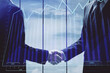 © peshkova - Double exposure of forex graph hologram and handshake of two men. Stock market concept.