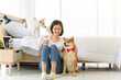 © bigy9950 - Young Asian woman relaxing and playing with three dogs (brown shiba inu, white shiba puppy and white maltese)in bedroom at home, Cheerful and nice couple with people and pet. Pet Lover concept