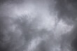 © ooddysmile - black and white storm clouds background. Light in the Dark and Dramatic Storm Clouds background, Dark clouds before a thunder-storm.