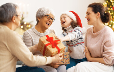 Wall Mural - family celebrating Christmas