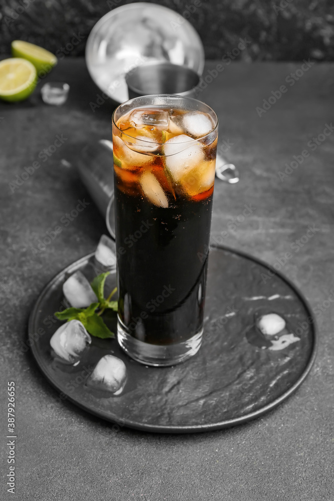 Glass of tasty Cuba Libre cocktail on table