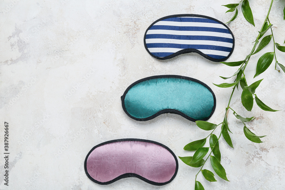 Sleeping masks on light background