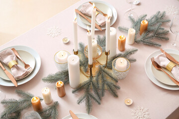 Beautiful table setting with Christmas decorations in living room