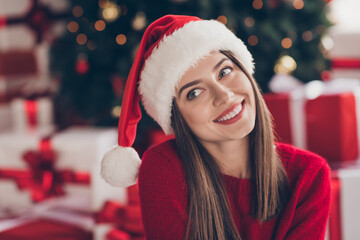 Poster - Photo of charming girl shiny smile look up wear santa headwear red pullover in decorated x-mas living room indoors