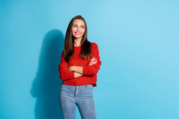 photo of charming girl cross hands look copyspace wear pullover isolated over blue color background