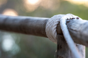 rope tied to a log of wood