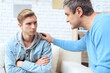 © freeograph - Father tries to talk to his son.