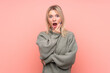© luismolinero - Young blonde Russian woman over isolated pink background surprised and shocked while looking right