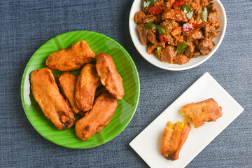 Canvas Print - Banana fry with Kerala beef curry , PazhamPori 
banana fritters homemade tea time snack fried in coconut oil and spicy meat curry , mutton stir fry Asian cuisine, side dish christian food Christmas