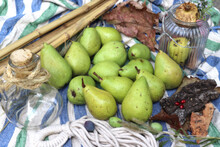 Pears With Dry Leaves, Bamboo Sticks And Other Decoration On A Blue/white Background