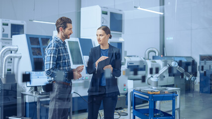 Aufkleber - Modern Factory: Female Project Manager and Male Engineer Standing, Talking, Using Digital Tablet for Programming and Monitoring Assembly Line with Robot Arm. Industry 4.0 Facility with CNC Machinery