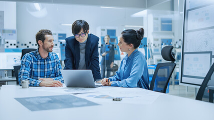 Poster - Modern Factory Office Meeting: Female Project Manager, Asian Branch Supervisor Talk with Chief Product Engineer who Shows Them Laptop Screen. Team of Professionals Solving Technological Problems