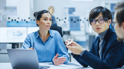 Aufkleber - Modern Factory Office Meeting Room: Multi Ethnic and Diverse Team of Engineers, Managers and Investors Talking Sitting at Conference Table, Analyzing Computer Printed Circuit Board Element