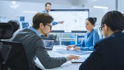 Poster - Modern Factory Office Meeting Room: Busy Diverse Team of Engineers, Managers and Investors Talking at Conference Table, Use Interactive TV, Analyze, Find Solutions, Discuss Concepts.