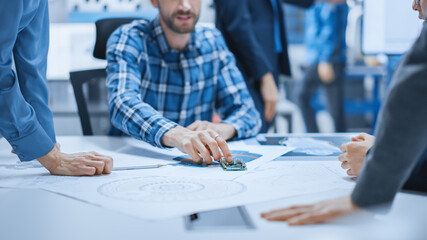 Aufkleber - Busy Diverse Team of Computer Engineers and Specialists Gather Around Conference Table and Discuss Electrical Prototype, Drafts and Blueprints, Find Problem Solutions. Office Meeting Room.
